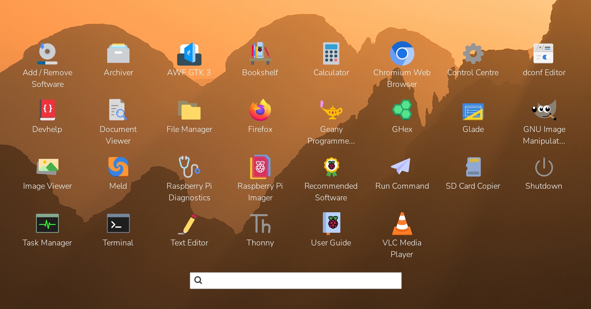 The new full-screen application launcher on Raspberry Pi OS: a grid of application icons over the desktop wallpaper with a search field at the bottom.